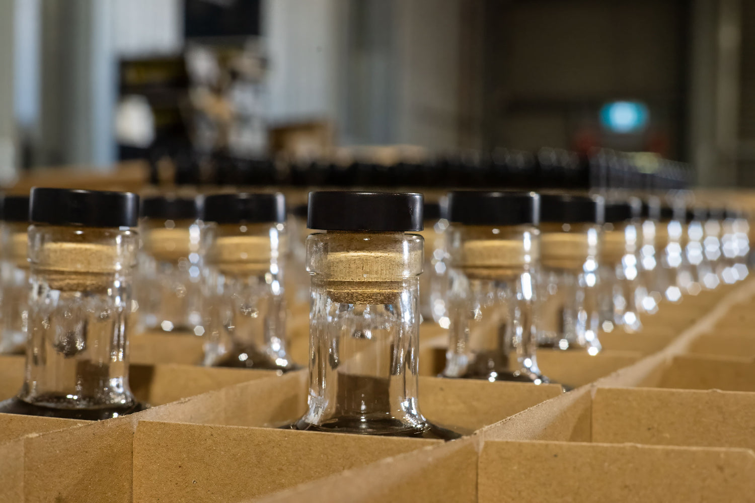 Photo of Glass Bottles In Cardboard Boxes