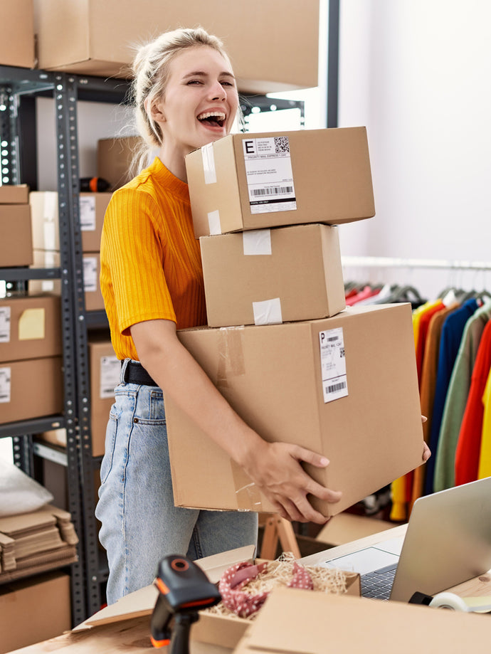 Photo of Small Business Owner Carrying Boxes