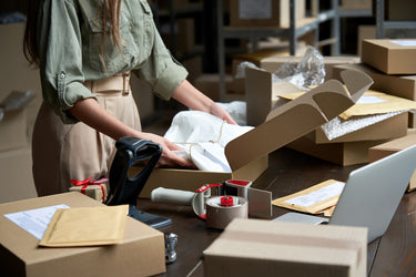 Photo of Small Business Packaging Up Order In Ecommerce Mailer Box