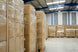 Stacks of wrapped boxes in a warehouse setting