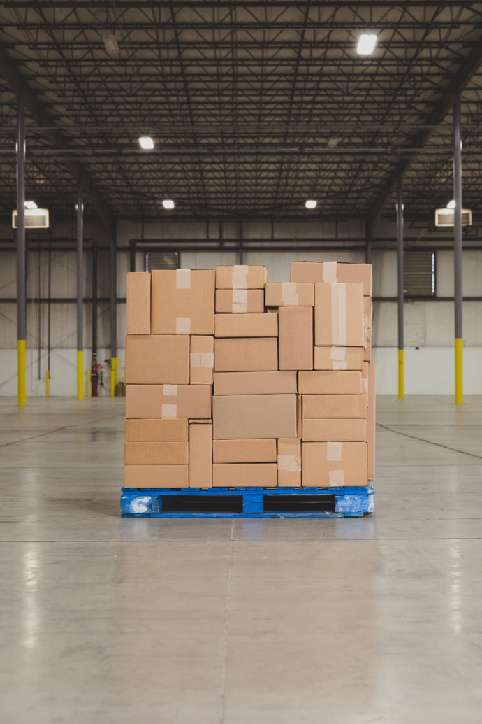 Pallet Of Boxes Stocked In Warehouse